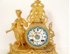 Gilded clock with Sèvres porcelain plaques, elegant woman, 19th century library