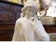 Large white marble sculpture of a pensive woman holding a torch Art Nouveau late 19th century