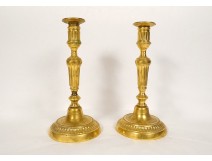 Pair of Louis XVI candlesticks, gilded bronze torches, monogram DD, 19th century