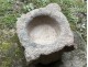 Old granite holy water stoup with ears, Brittany, 13th century