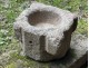 Old granite holy water stoup with ears, Brittany, 13th century