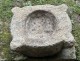 Old granite holy water stoup with ears, Brittany, 13th century