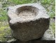 Old granite holy water stoup with ears, Brittany, 13th century