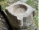 Old granite holy water stoup with ears, Brittany, 13th century