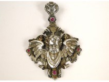 Pendant, sterling silver jewelry, rubies and garnets, decorated with the head of a cherub, nineteenth