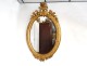 Oval mirror wood frame stucco golden flower ice bizautée Louis-Philippe nineteenth