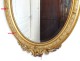 Oval mirror wood frame stucco golden flower ice bizautée Louis-Philippe nineteenth