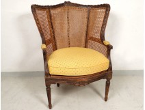 Bergere caned Louis XVI carved wood ears flowers eighteenth century