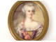 Miniature peinte portrait jeune femme fleurs cadre ovale laiton doré XIXème