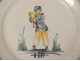 Nevers faience plate characters acrobat tambourine eighteenth century