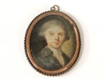 Miniature painted young man medallion golden metal frame eighteenth century