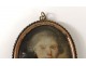 Miniature painted young man medallion golden metal frame eighteenth century