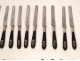 24 knives of ebony and silver monogrammed crowned, 19th